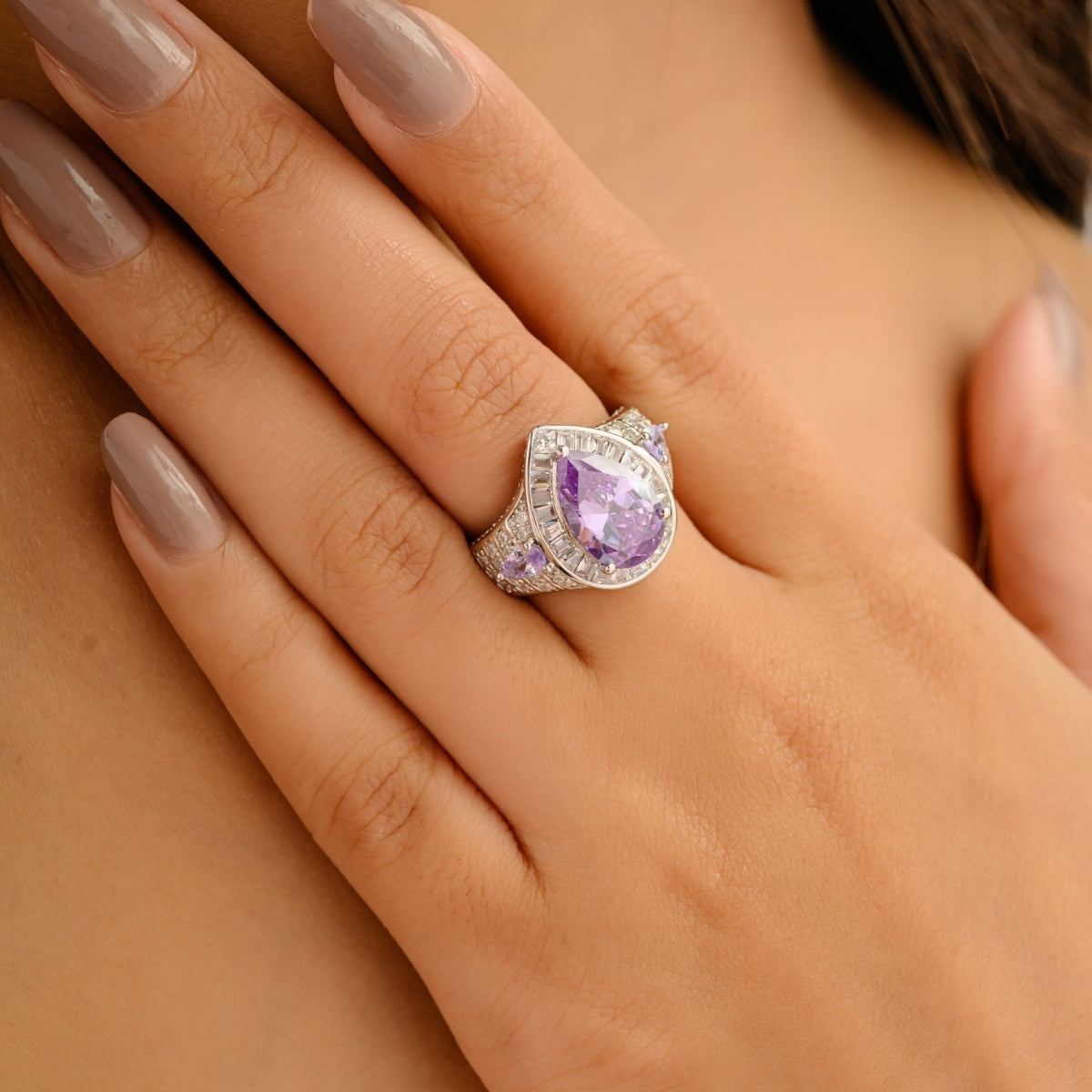 Opulent Silver Ring with Bold Pear Amethyst and CZ Baguettes